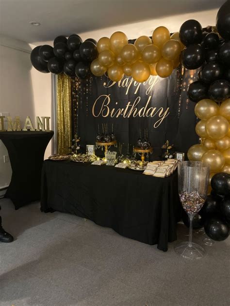 St Birthday Party With Black And Gold Balloons