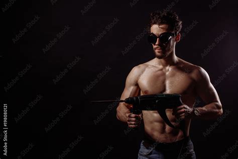 Sexy Naked To The Waist Worker With Ecectric Drill Renovation Role Playing Game Stock Photo