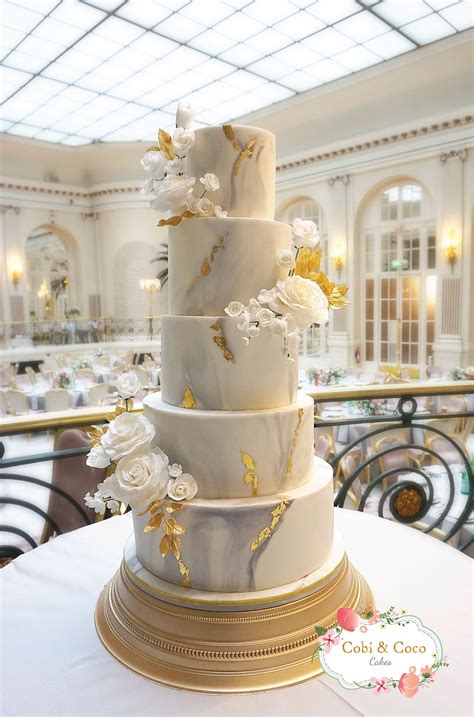 Elegant Marble And Gold Leaf Wedding Cake With White Roses