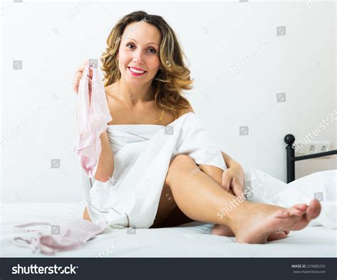 Middleaged Woman Takes Off Her Underwear库存照片229880293 Shutterstock