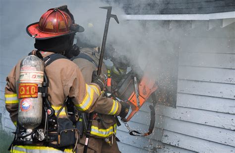 Firefighters Cutting Hole in Burning House · Free Stock Photo