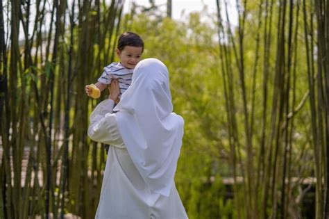 Premium Photo Mother With Son Standing Outdoors