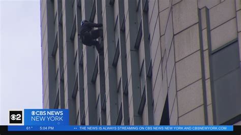 Man Taken Into Custody After Hanging Out Window For Hours In Midtown