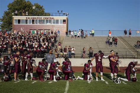 Kalamazoo Central football players take a knee during anthem - mlive.com