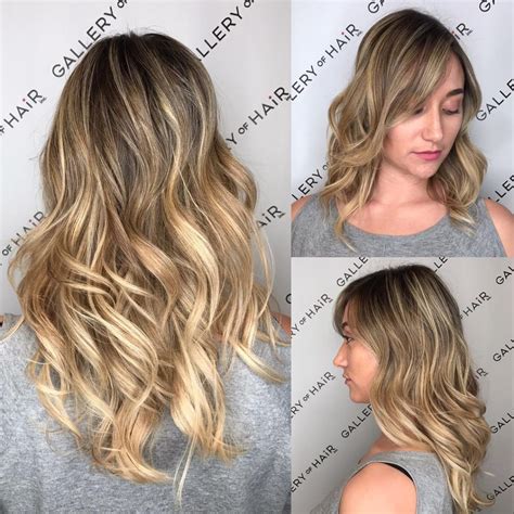 Long Wavy Layered Cut With Blonde Balayage Color Melt The Latest