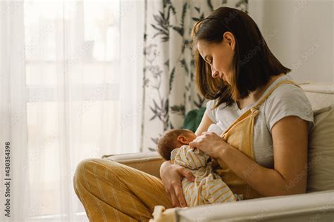 Newborn Baby Boy Sucking Milk From Mothers Breast Portrait Of Mom And