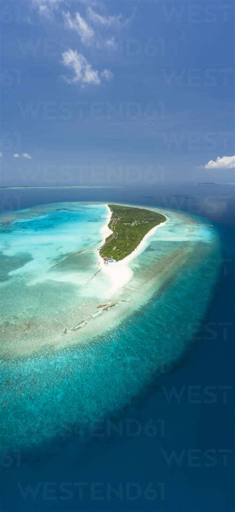 Vertical panoramic aerial view of an island, Maldives, Laccadive Sea. stock photo