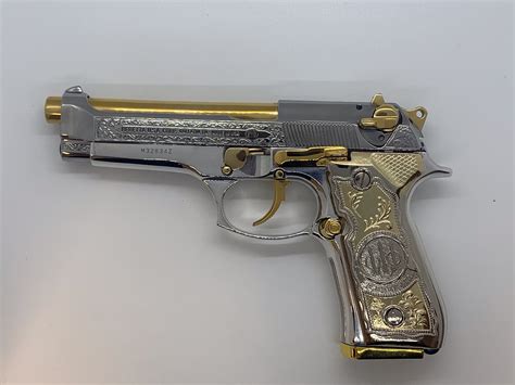 gold plated beretta fs american golden gun