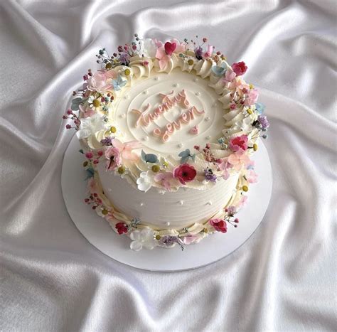 Pretty Birthday Cake With Pink And Blue Flowers