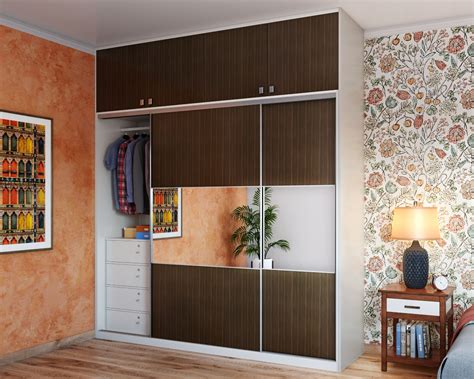 Tawny Balsam Wardrobe Design With Mirror And Sliding Door | Livspace