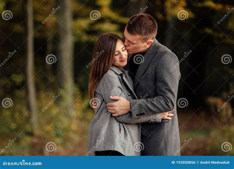 Beautiful Young Couple Man And Woman In Love Boyfriend And Girlfriend Hugging Together In Park