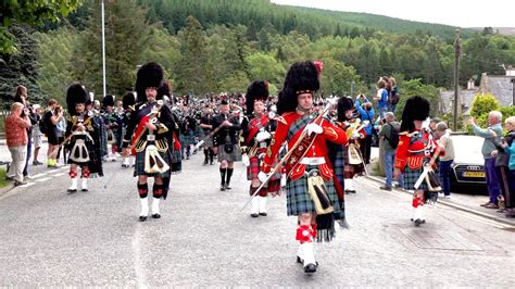 Massed Pipes And Drums Parade Through Town To The 2019 Ballater Highland