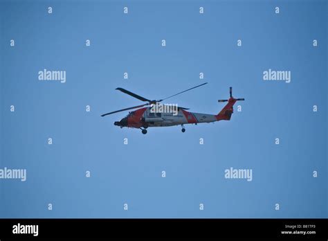 US Coast Guard helicopter in the air Stock Photo - Alamy