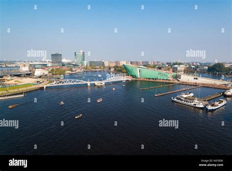 Tourist ships in canal of Amsterdam, aerial view Stock Photo - Alamy