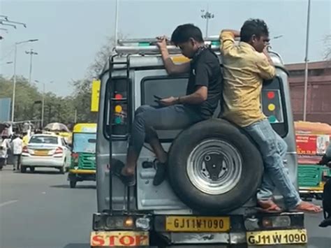 Two People Traveled By Sitting On The Spare Tire Of The Storm The