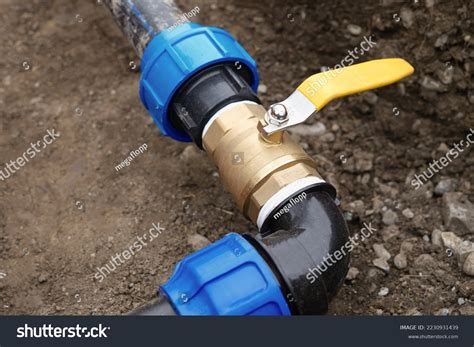 Close Up Underground Irrigation System Elbow Fitting Stock Photo