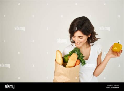 Brunette With A Package Of Groceries Supermarket Delivery Stock Photo Alamy