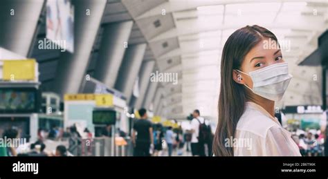 Woman Wearing Surgical Mask In Train Or Bus Station Walking Indoors Prevention In Public Spaces