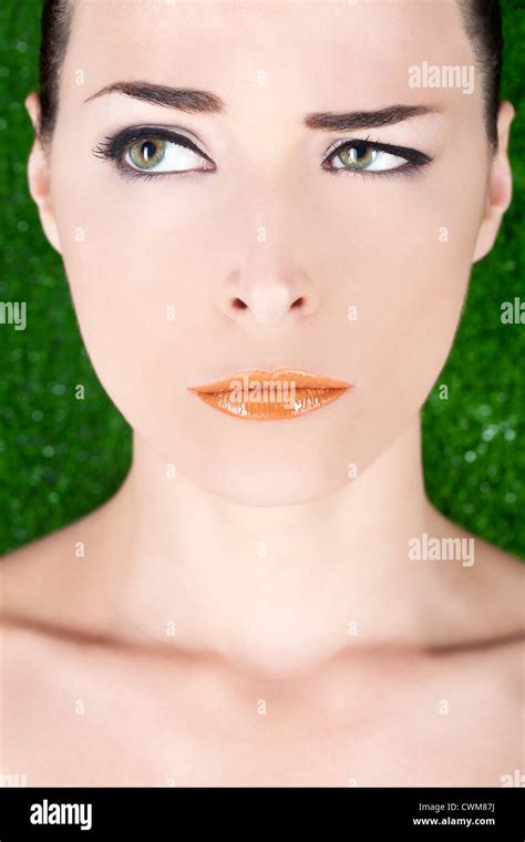 Closeup Portrait Of A Beautiful Angry Woman With Glossy Lips Looking