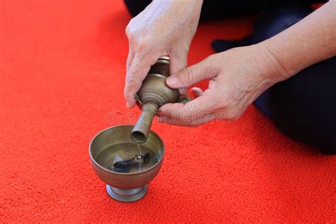 Buddhist S Grail Pouring Water Into Container Stock Photo Image Of