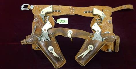 2 VINTAGE KIDS COWBOY HOLSTER SETS WITH CAP GUNS: