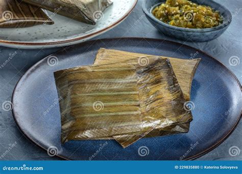 Tamales Traditional Dish Of Mexican Cuisine Wrapped In Green Leaves