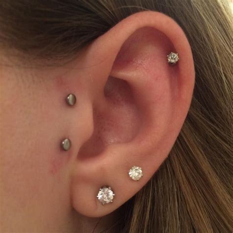 vertical tragus; sideburn; unique ear piercing | Earings piercings, Body jewelry piercing ...