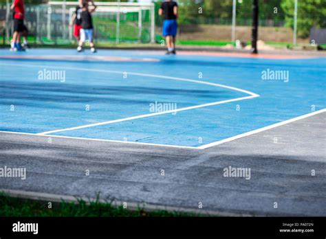 Abstract Blurry Background Of Boys Playing Basketball In Outdoor