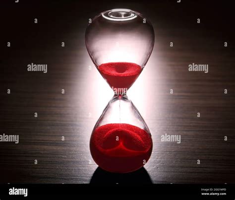 Crystal Hourglass With Red Sand On Dark Background Stock Photo Alamy