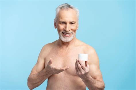 Premium Photo Portrait Of Smiling Bearded Gray Haired Senior Man With Naked Torso Holding
