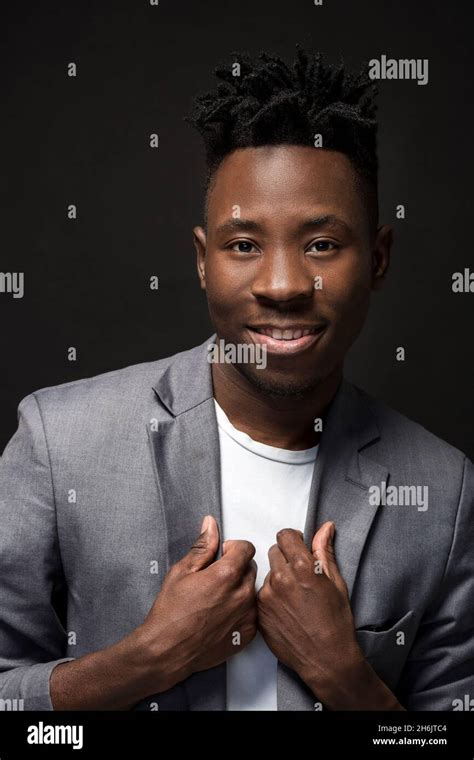 Close Up Portrait Of Handsome Black Man With Charming Smile Studio