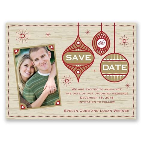 save the date card with two ornaments hanging from it's sides and an ...