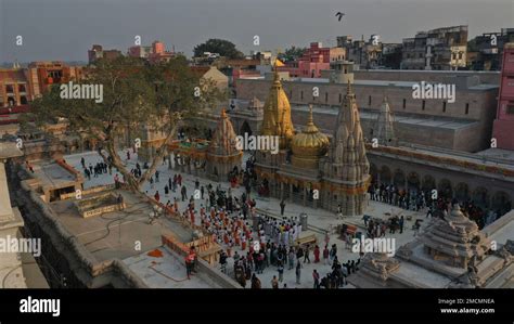 Devotees Stand In Queue To Offer Prayers At The Kashi Vishwanath Temple