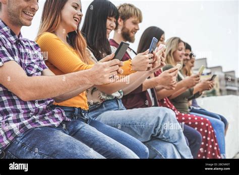 Group Of Friends Using Smart Mobile Phones App Teenagers Addiction To