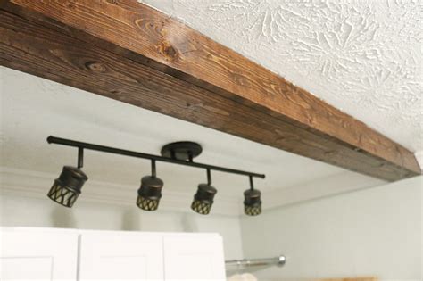 How To Diy A Faux Wooden Ceiling Beam Wooden Beams Ceiling Faux Ceiling Beams Ceiling Beams