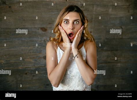 Surprised Attractive Young Woman Shocked About Something Keeping Mouth