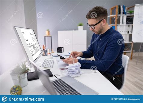 Businessman Calculating Invoice In Office Stock Photo Image Of