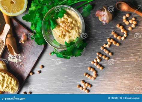 Traditional Hummus Or Houmous Appetizer Made Of Mashed Chickpeas With