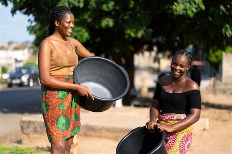 African Woman Carrying Water