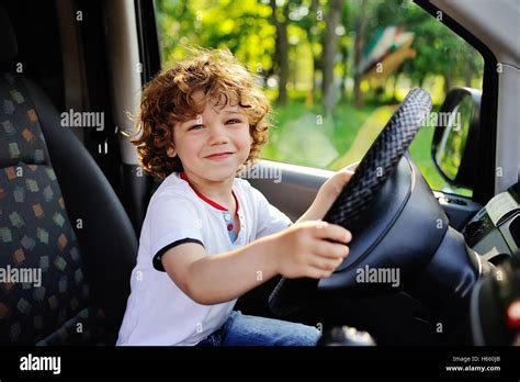 Boy driving a car hi-res stock photography and images - Alamy