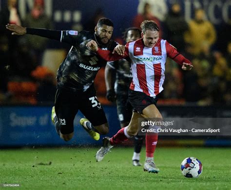 Lincoln Citys Jack Diamond Is Fouled By Milton Keynes Dons Zak