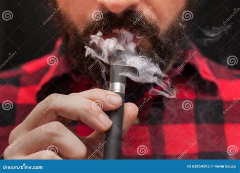 Man Smoking or Vaping E-cigarette Stock Image - Image of beard, cigar ...