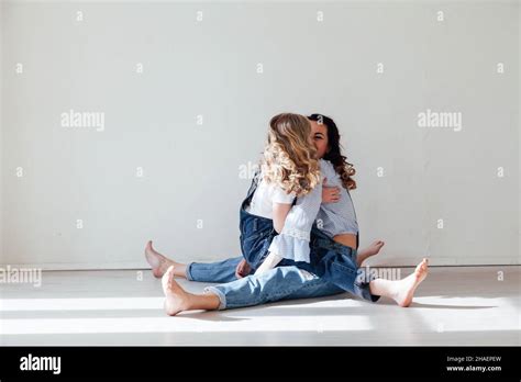 Mother And Daughter In Jeans Hug And Smile Stock Photo Alamy