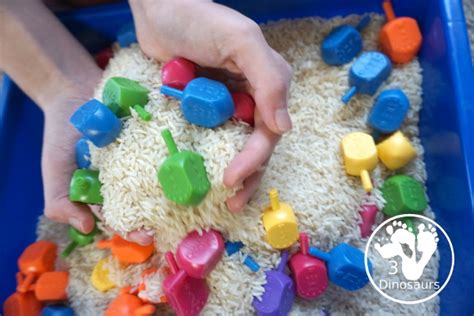 Dreidel Sensory Bin With Rice Dinosaurs