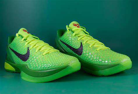 Green Nike Athletic Shoes On Green Surface · Free Stock Photo