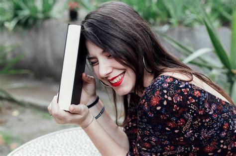 Free Photo | Young girl holding a book