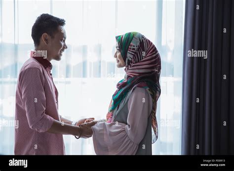 romantic muslim couple holding hands Stock Photo - Alamy