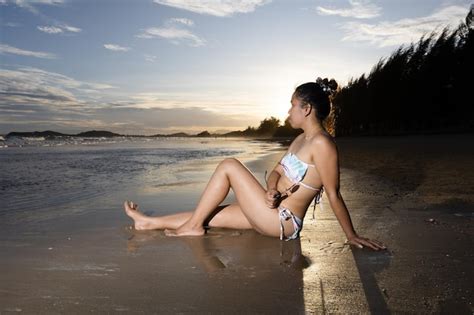Premium Photo Portrait Of An Asian Woman In A Bikini On The Beach In The Evening
