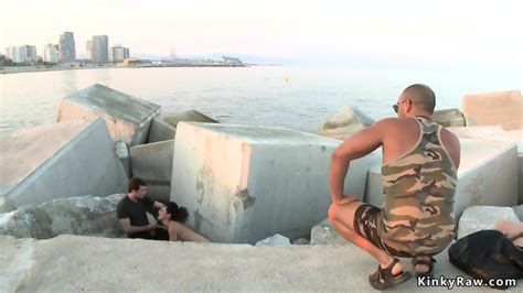 Brunette In Metal Shackles In Public