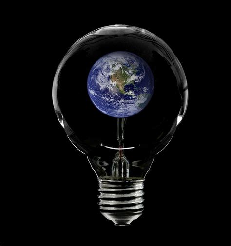 Incandescent Lightbulb With The Planet Earth Inside Photograph By Russell Shively